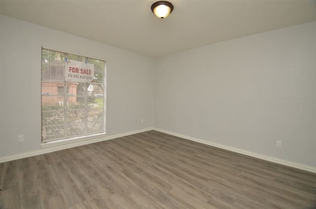 spare room featuring hardwood / wood-style flooring