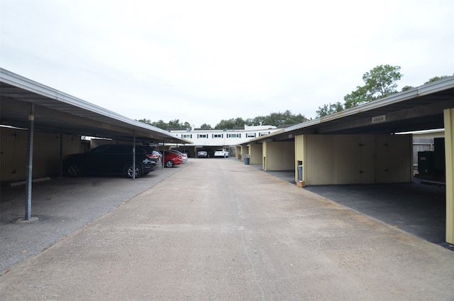 view of vehicle parking featuring a carport