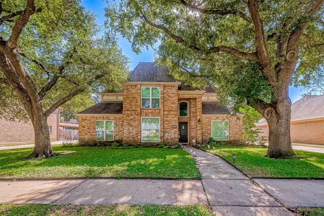 view of property featuring a front yard