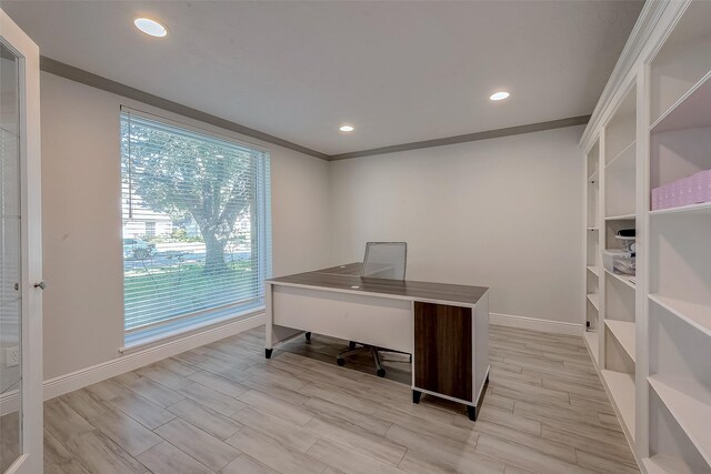 office featuring light wood-type flooring and crown molding