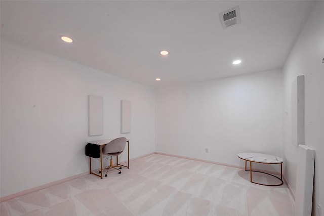 spare room with light colored carpet