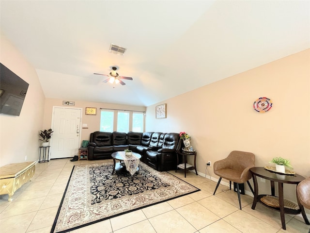 tiled living room featuring ceiling fan and lofted ceiling