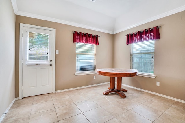 unfurnished dining area featuring lofted ceiling, ornamental molding, and light tile patterned flooring