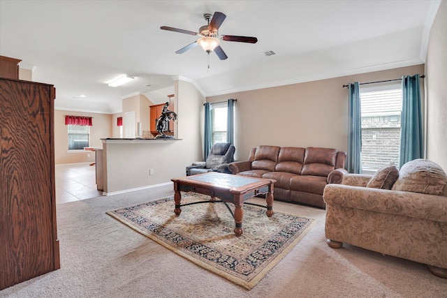 living room featuring lofted ceiling, light colored carpet, ceiling fan, and ornamental molding