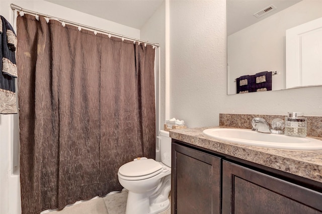 full bathroom featuring tile patterned flooring, vanity, toilet, and shower / tub combo