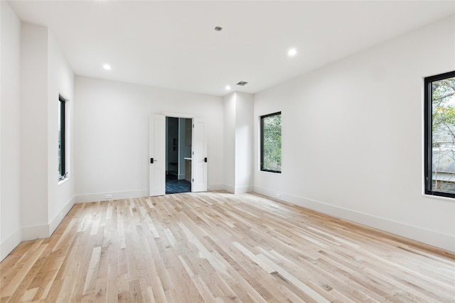 unfurnished room featuring light hardwood / wood-style flooring