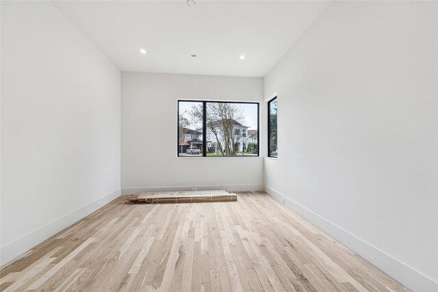 unfurnished room with light hardwood / wood-style floors