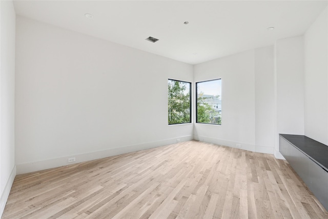 spare room featuring light hardwood / wood-style flooring