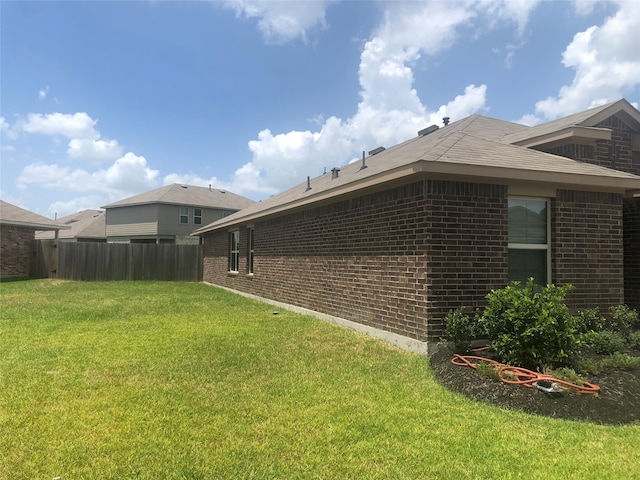 view of property exterior with a yard