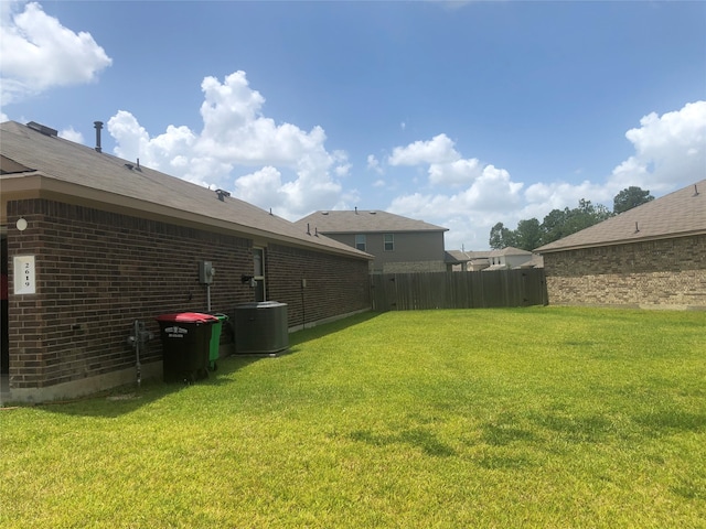 view of yard with central AC