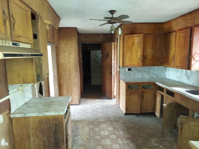 kitchen featuring backsplash and ceiling fan