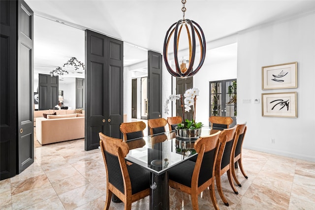 dining space with french doors and a notable chandelier