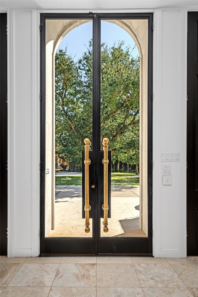 entryway featuring french doors