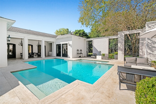 view of pool featuring a patio and an outdoor hangout area