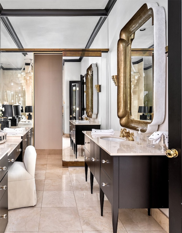 bathroom with crown molding and vanity