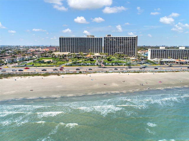 bird's eye view featuring a view of the beach and a water view