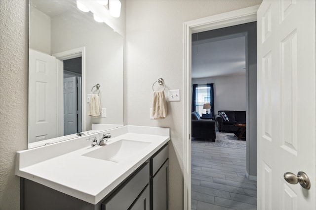 bathroom featuring hardwood / wood-style floors and vanity