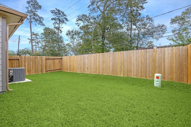 view of yard with central AC unit