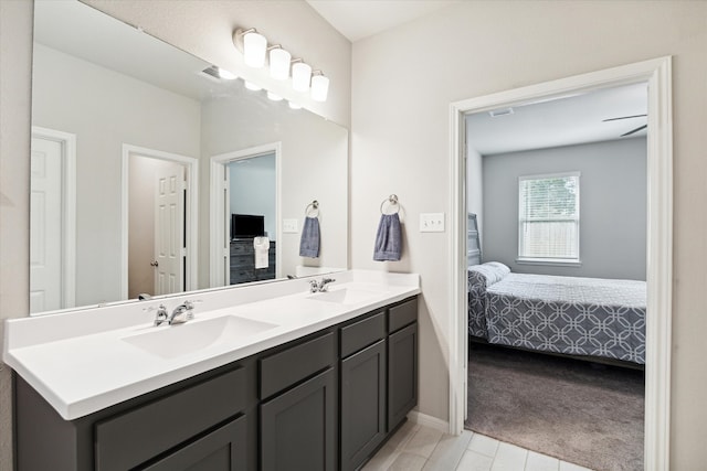 bathroom featuring tile patterned flooring and vanity