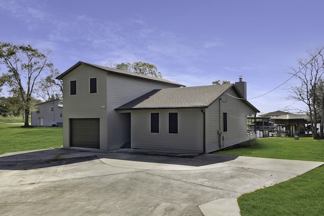 exterior space featuring a front yard and a garage