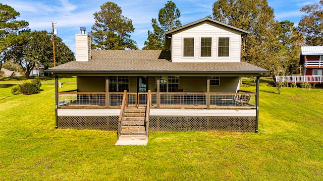 back of property with a porch and a lawn