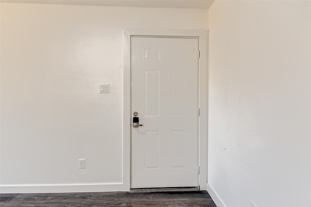 doorway featuring dark wood-type flooring