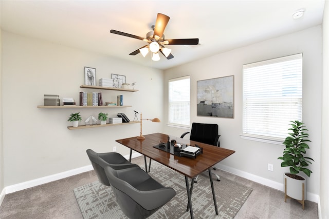 home office with carpet floors and ceiling fan