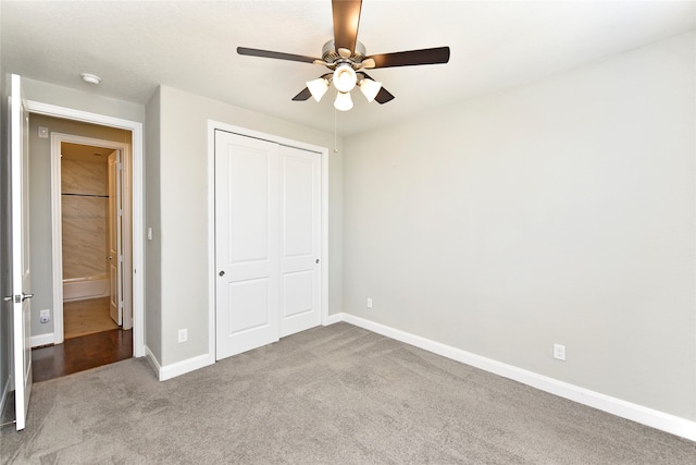 unfurnished bedroom featuring a closet, light colored carpet, and ceiling fan