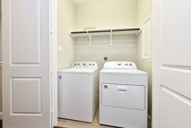 washroom featuring washer and clothes dryer