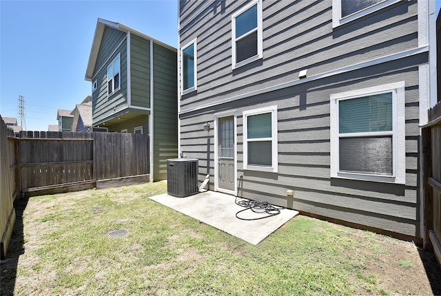 view of yard featuring a patio area and central air condition unit