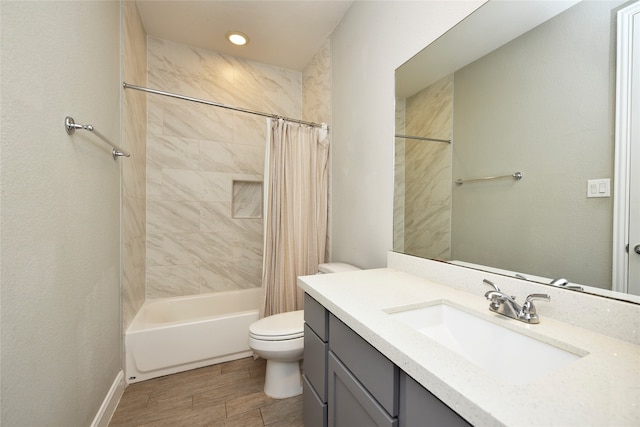 full bathroom with shower / bath combo with shower curtain, toilet, wood-type flooring, and vanity