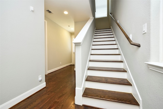 stairway with hardwood / wood-style floors