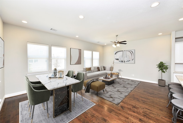 living room with ceiling fan and dark hardwood / wood-style flooring