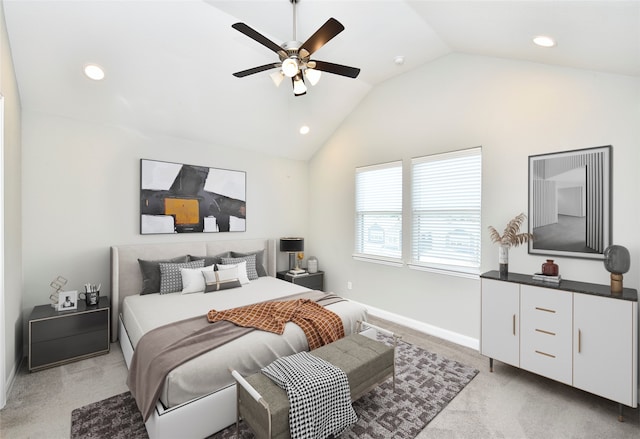 carpeted bedroom with vaulted ceiling and ceiling fan