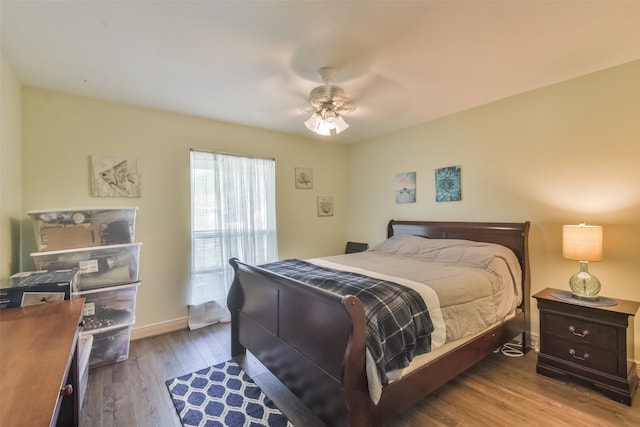 bedroom with wood-type flooring and ceiling fan