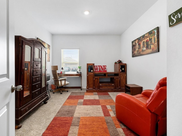 living area with carpet flooring