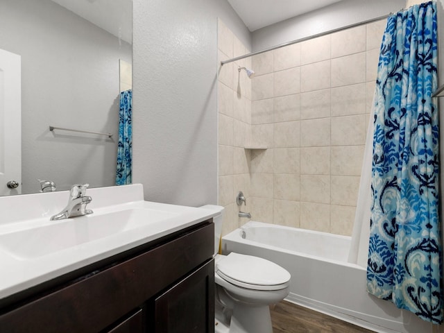 full bathroom featuring shower / bath combination with curtain, vanity, wood-type flooring, and toilet