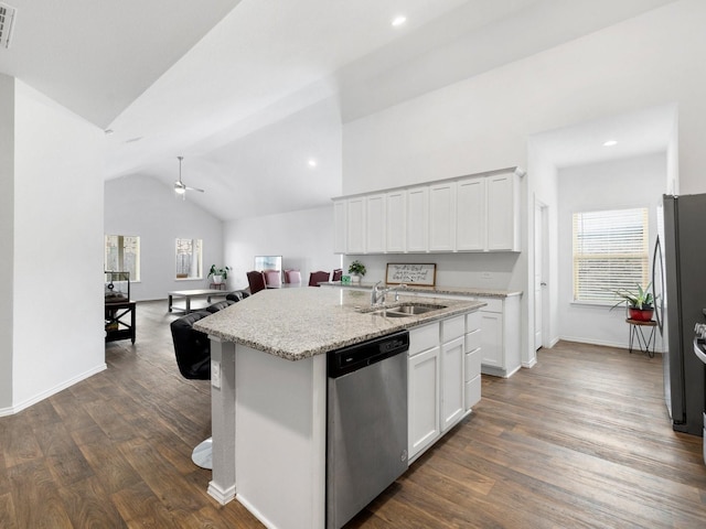 kitchen featuring white cabinetry, sink, stainless steel appliances, lofted ceiling, and a kitchen island with sink