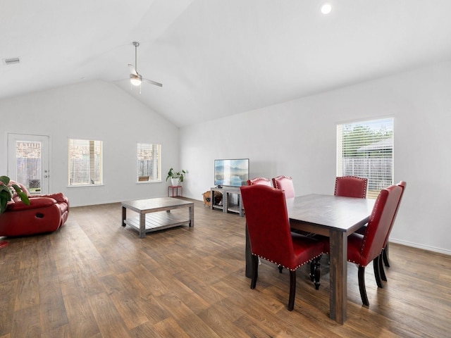 dining room featuring ceiling fan, hardwood / wood-style floors, and high vaulted ceiling