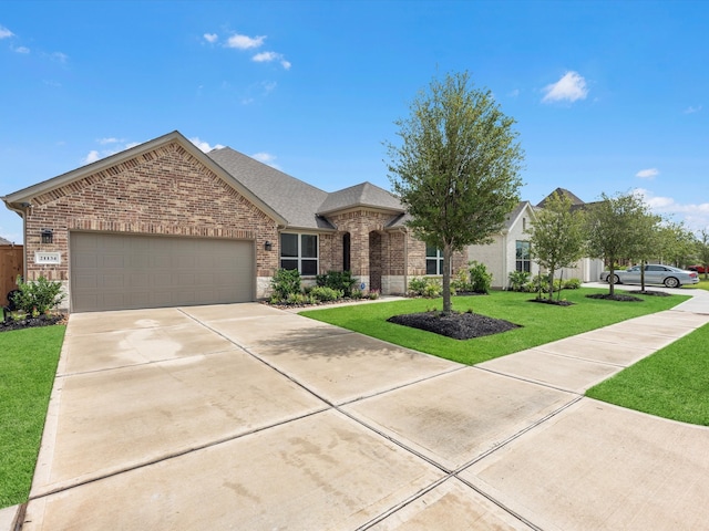 view of front facade with a garage and a front lawn