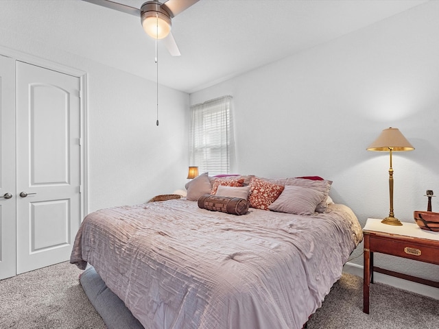 bedroom with carpet floors, a closet, and ceiling fan