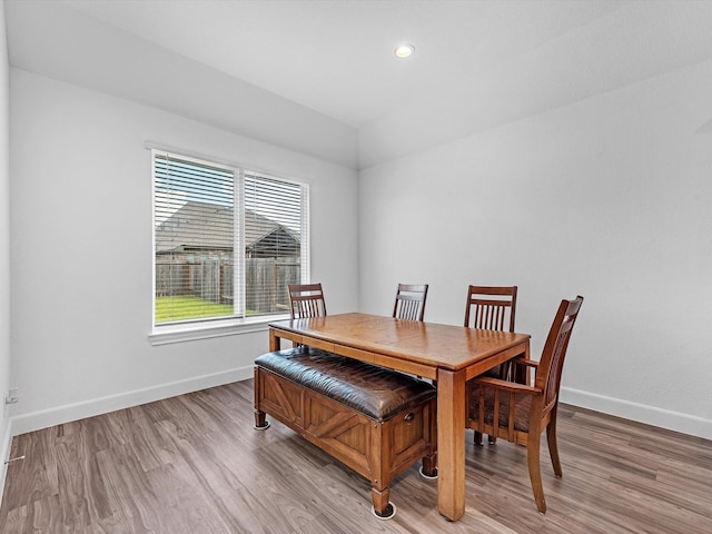 dining area with plenty of natural light and light hardwood / wood-style flooring