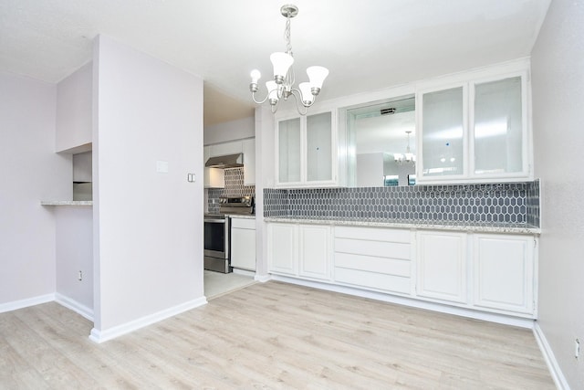 kitchen with white cabinets, a notable chandelier, stainless steel range with electric cooktop, and hanging light fixtures