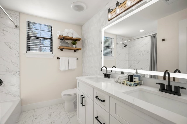 full bathroom featuring toilet, vanity, and tiled shower / bath combo