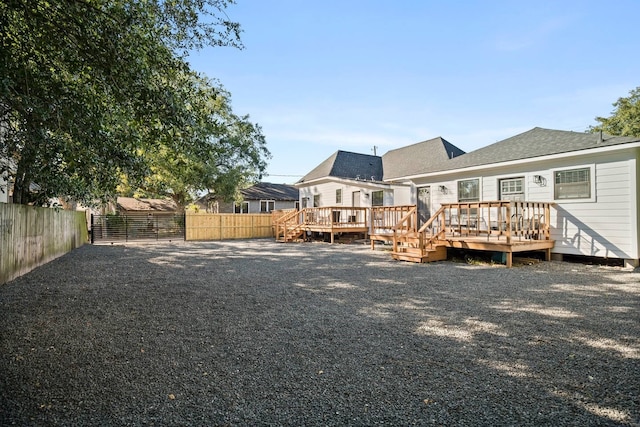 rear view of property with a deck