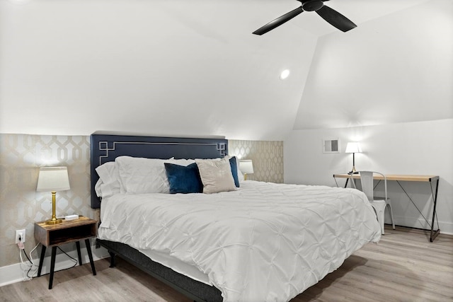 bedroom featuring vaulted ceiling, ceiling fan, and hardwood / wood-style floors