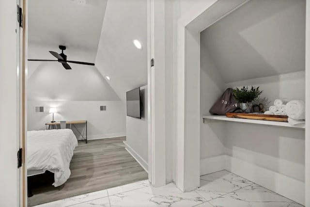 bedroom with ceiling fan and vaulted ceiling