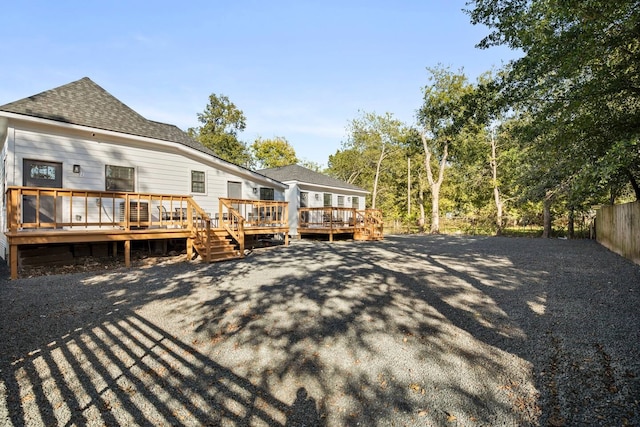 back of property featuring a deck