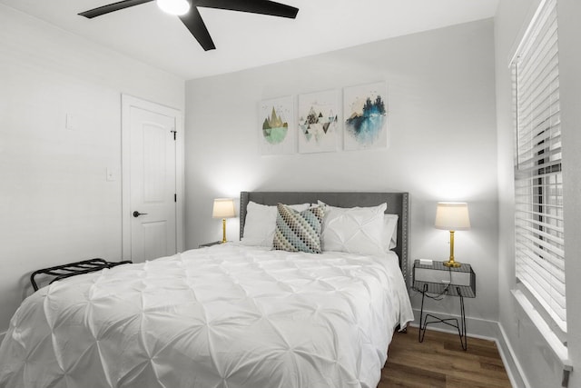 bedroom featuring ceiling fan and dark hardwood / wood-style floors