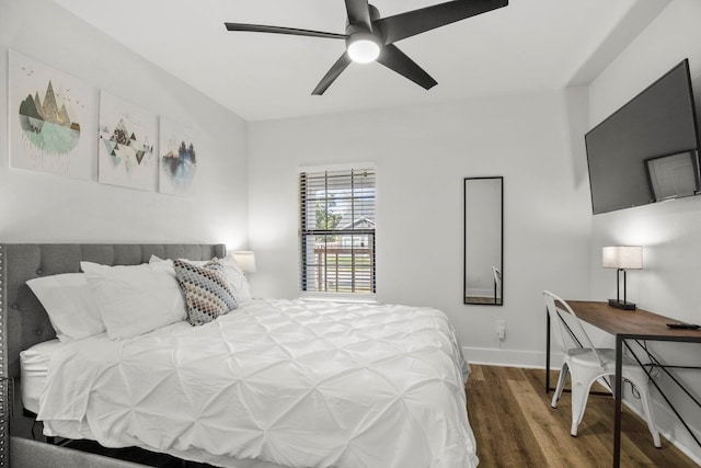 bedroom with ceiling fan and hardwood / wood-style floors